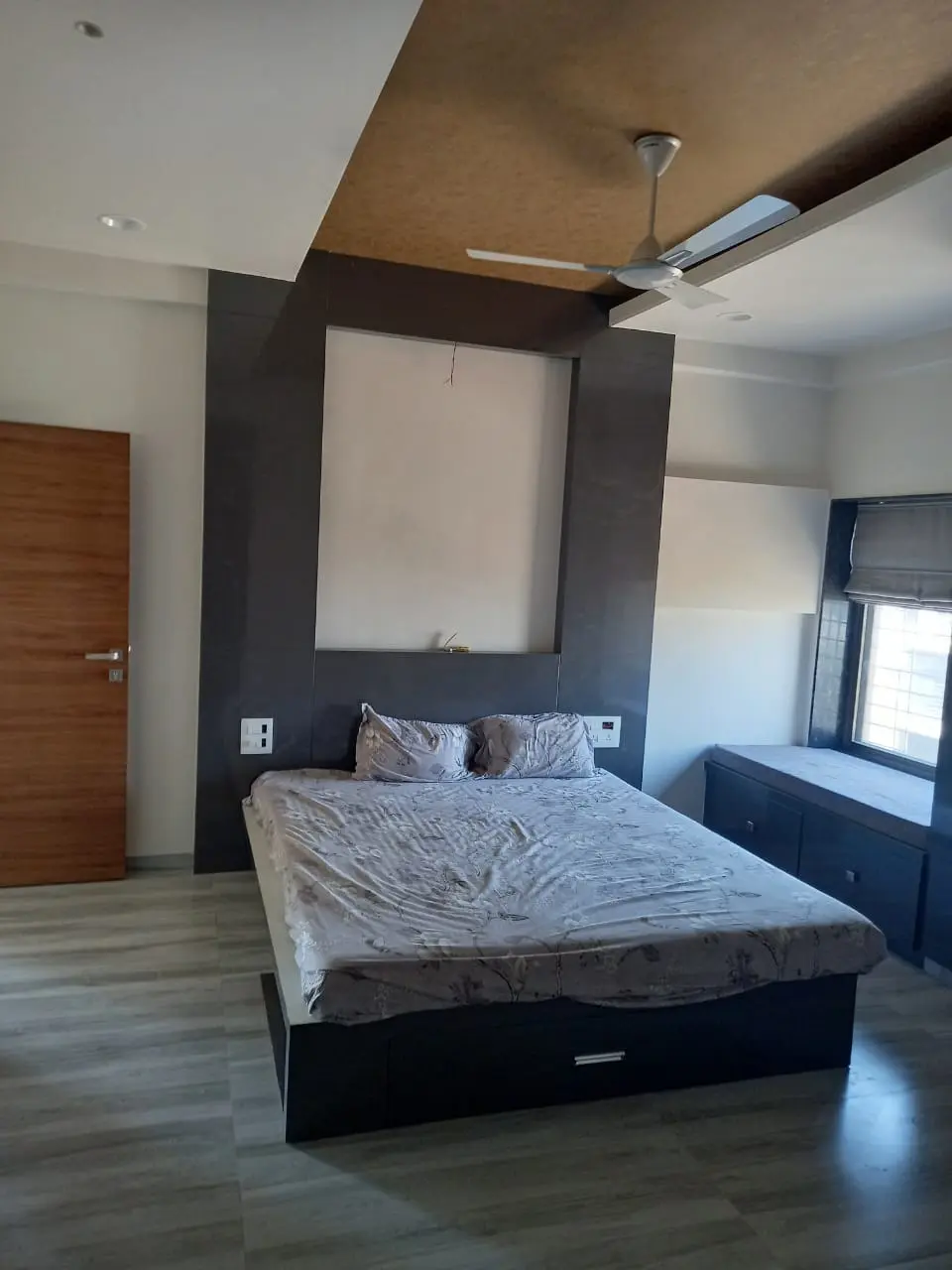 a bed with a white mattress on it  showing best interior design pune