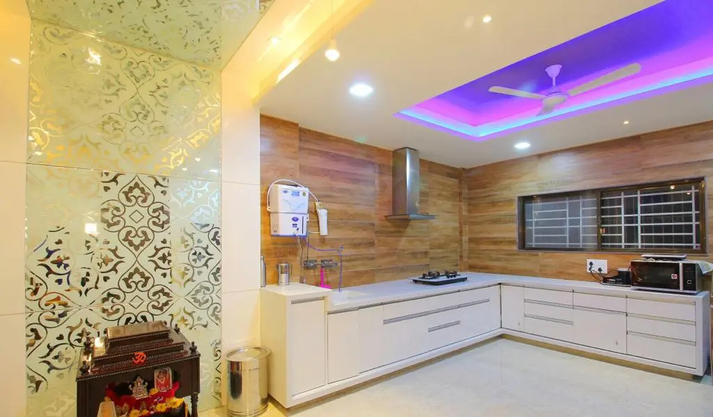 luxurious kitchen with white combination showing best interior design pune