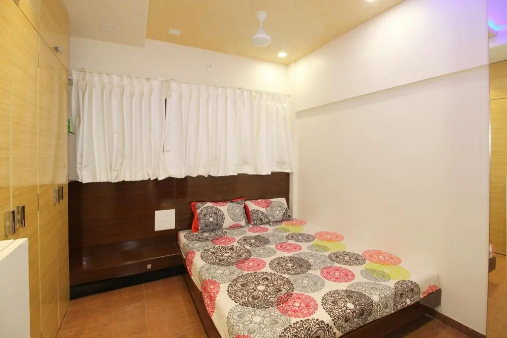 creative bedroom with beautiful ceiling showing best interior design pune