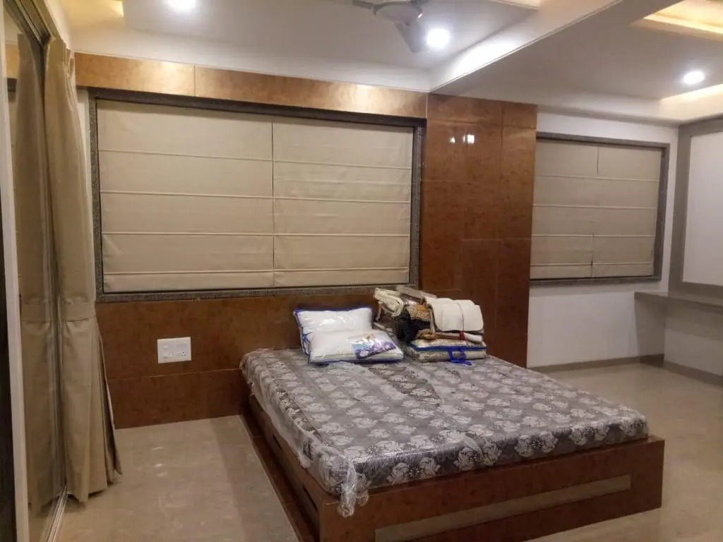 luxurious bedroom with beautiful ceiling showing best interior design pune