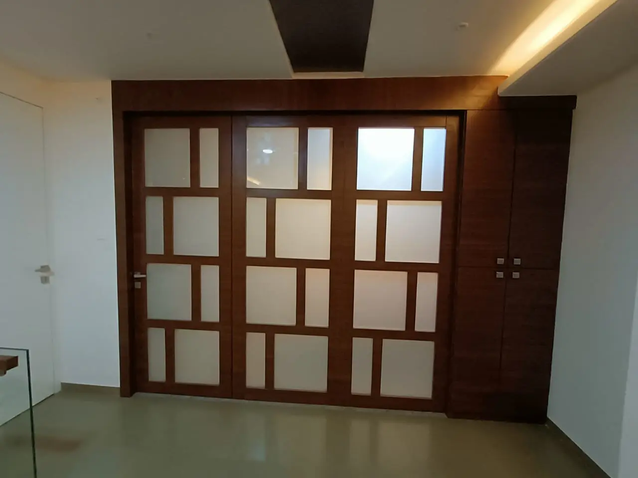 a door with glass panels showing best interior design pune