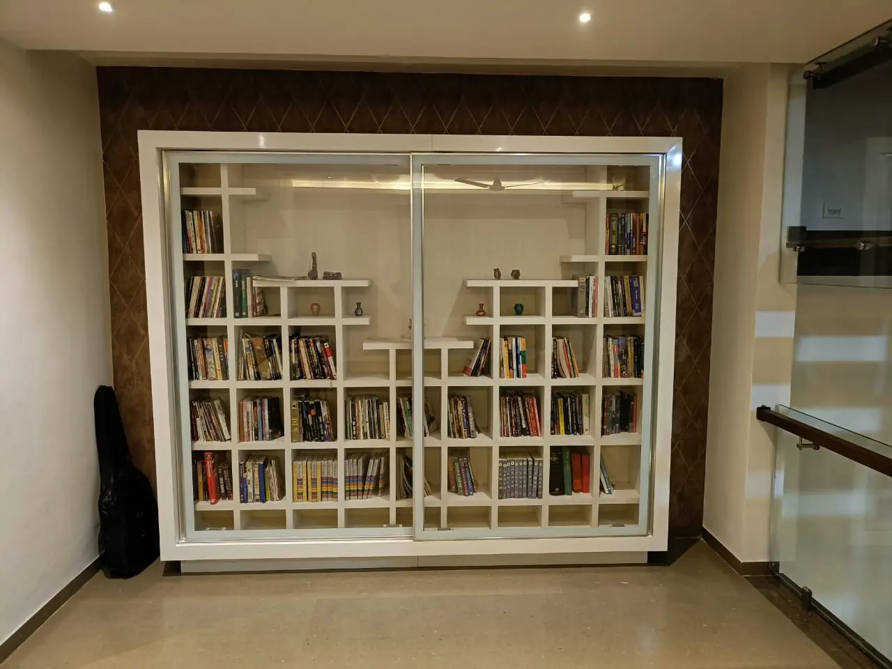 unique books cabinate in white laminate showing best interior design pune