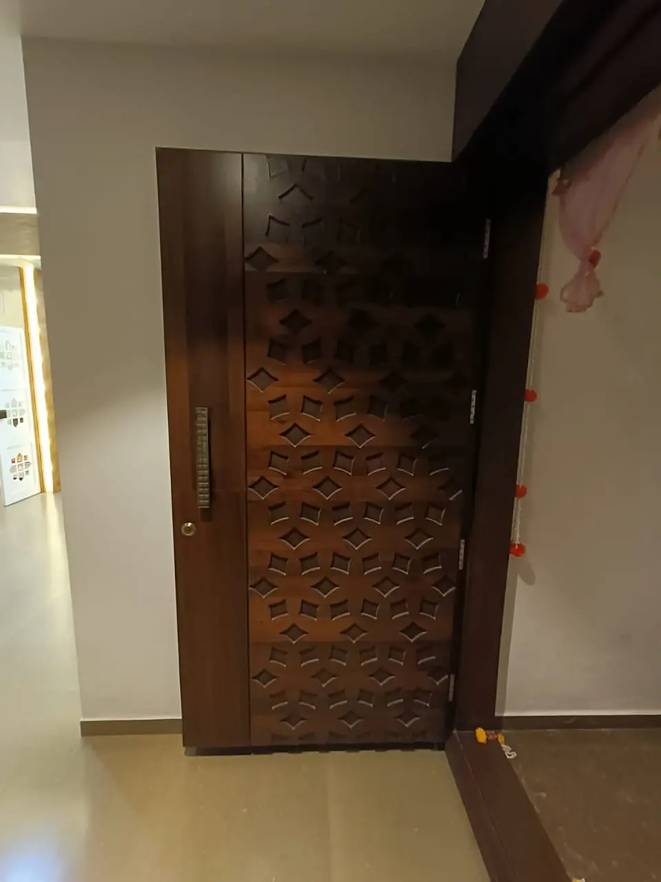 a wooden door with a pattern on it showing best interior design pune